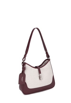 Shoulder handbag with cream fabric body and dark burgundy leather trim, silver clasp, and matching branded tag attached to strap.