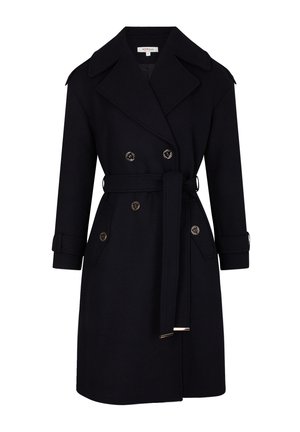 Trench-coat bleu marine en tissu texturé, avec des boutons double boutonnage, une taille ceinturée et des épaulettes sur les épaules.