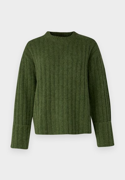 Green knitted sweater with a ribbed pattern, round neckline, and long sleeves. Fabric appears soft and textured, with a boxy fit.