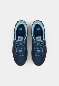 Navy blue sneakers with a smooth texture, featuring light blue laces and accents. A rubber gum sole and logo visible on the lateral side.