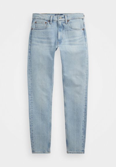 Gai zili džinsi ar sašaurinātu kāju, piecām kabatām, pogu aizdari un vieglu izbalējušu tekstūru.