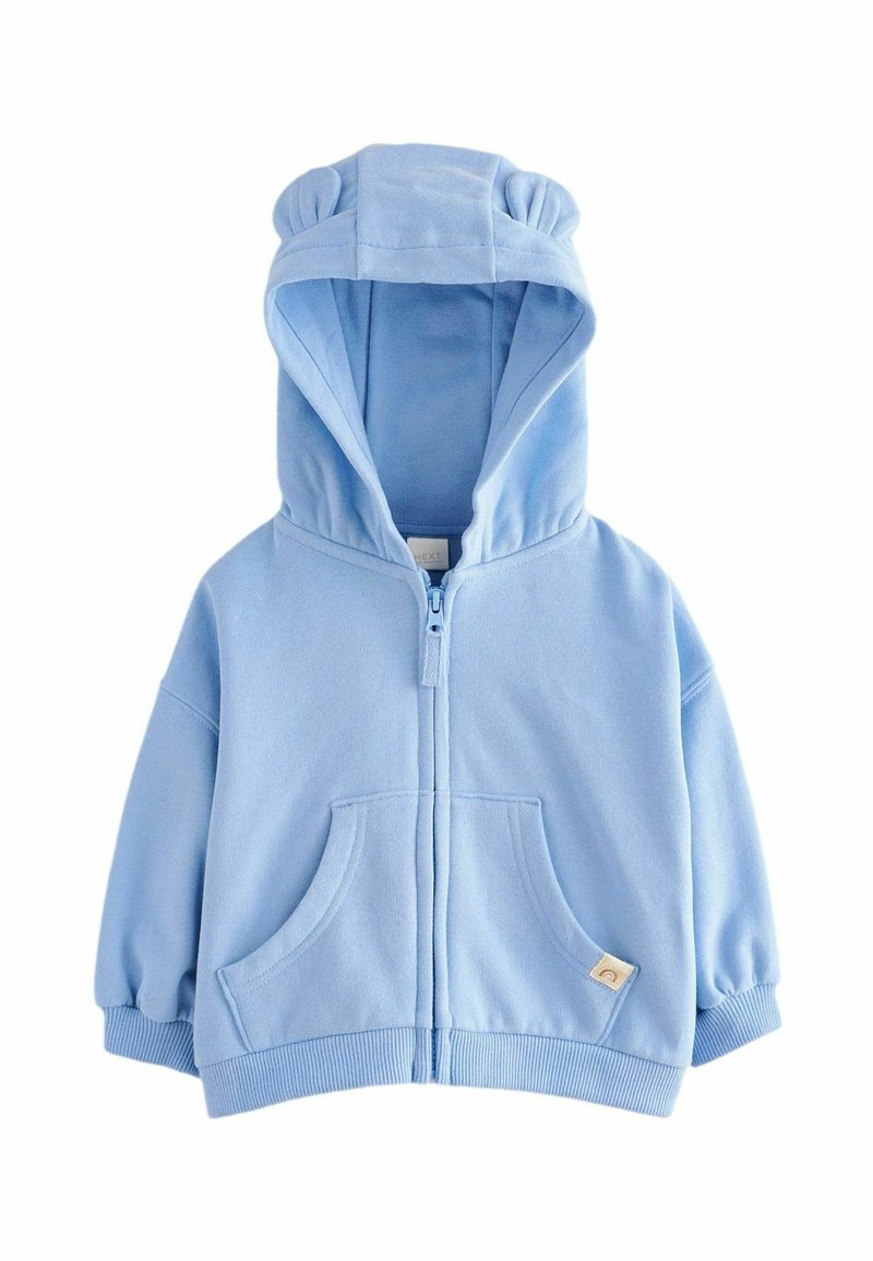 Lichtblauwe hoodie gemaakt van zachte fleece. Beschikt over een rits sluiting, twee voorzakken en ronde oortjes op de capuchon.