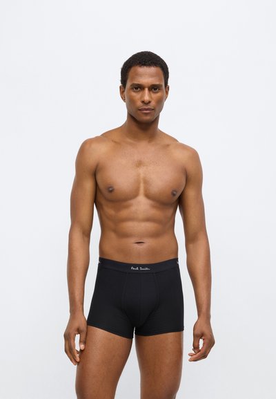 Μαύρα βαμβακερά μποξεράκια με εφαρμοστό σχεδιασμό, σε μονόχρωμο χρώμα και ελαστική ζώνη μέσης με την επιγραφή "Paul Smith" σε λευκό κείμενο.