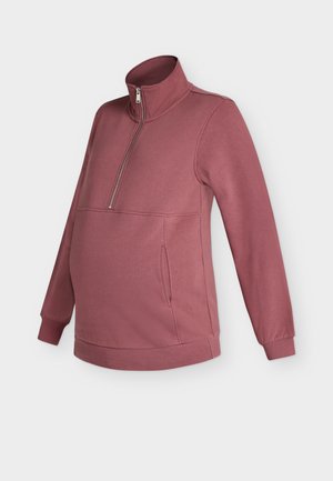 Lilla toonis rasedate pusa kvart-tõmblukuga, kõrge krae, pikad varrukad, ees kängurutasku ning soonilised varrukaotsad ja alumine äär.