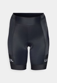 Sorte sykkelshortser med tettsittende passform, laget av glatt, elastisk stoff. Har polstret seteområde og kontrastfarget hvit logo på siden.