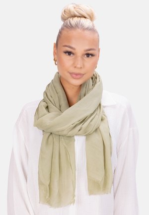 Light green scarf made of soft, lightweight fabric, featuring frayed edges and a loose, flowing design, draped around the neck.