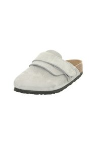 Gray suede slip-on shoe with two broad adjustable straps, textured upper, and a black rubber sole. Designed for comfort and ease of wear.