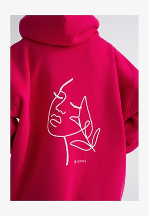 Hoodie fuchsia avec une illustration de visage dessinée à la ligne en blanc et le texte "MIRONS" en dessous. Tissu doux et coupe décontractée.