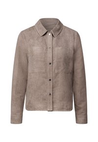 Taupe Kordjacke mit Kragen, zwei Brusttaschen und schwarzen Knöpfen. Lange Ärmel mit knöpfbaren Manschetten. Glatte Textur.