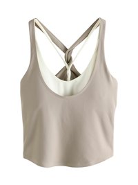 Beež värvi lühike põlvpikkusega topp ümarate kaeluse ja kriss-krossi seljaga, millel on kontrastne valge vooder. Sile kangapind.