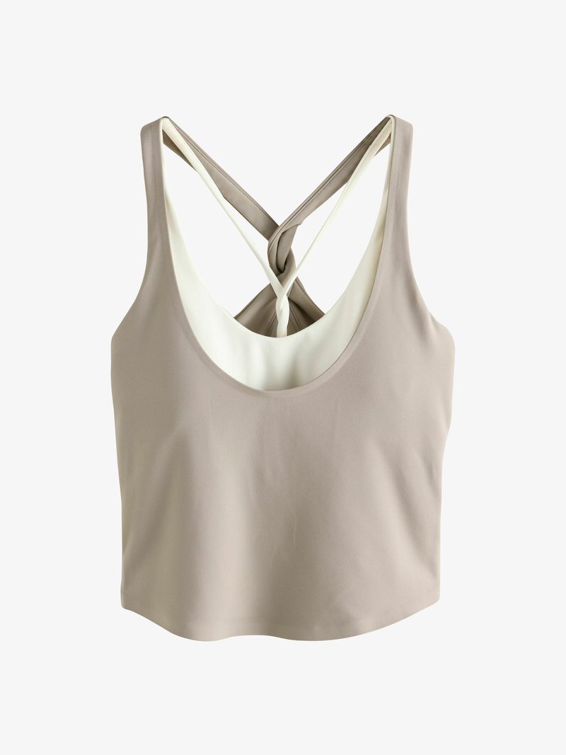 Beež värvi lühike põlvpikkusega topp ümarate kaeluse ja kriss-krossi seljaga, millel on kontrastne valge vooder. Sile kangapind.