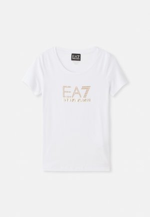 Valkoinen puuvillatee-paita pyöreällä kaula-aukolla, jossa on kultasävyinen rhinestone-logo "EA7 EMPORIO ARMANI" keskitettynä etuosassa.
