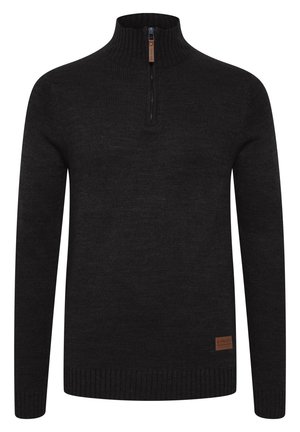 Maglione nero a maglia con colletto alzato, dotato di chiusura a mezza zip e polsini e orlo a costine. Tessuto strutturato con una leggera lucentezza.