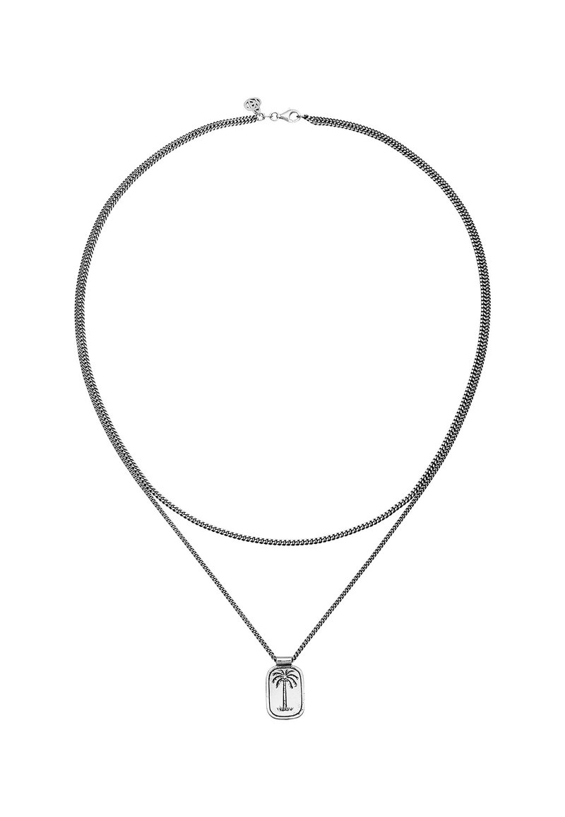 Silverfärgad lagerhalsband med kedjedesign och palmträdsberlock. Kedjan har en strukturerad yta med en slät metallfinish.