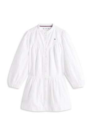 Vestido camisa blanco con cuello redondo, abotonadura frontal, cintura elástica y mangas largas abullonadas con un delicado patrón texturizado.