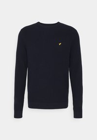 Pull en maille bleu marine à manches longues avec col rond et petit logo jaune brodé sur la poitrine gauche.
