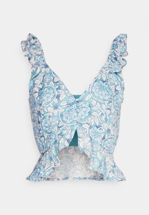 Blue floral-patterned top with ruffled straps, cut-out front, and textured fabric. Features intricate white and aqua detailing throughout.