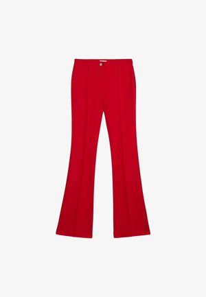 Czerwone spódnie w kształcie dzwonów, wykonane z gładkiego materiału, z zapięciem na guzik z przodu i dwoma zakładkami z przodu dla dodania detali.