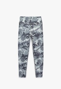 Læggings med bølgemønster i grå, hvid og sort. Fremstillet af strækbart materiale, med høj talje og sømløst design.