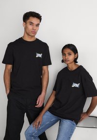 Tommy Jeans FLOWER POWER TEE UNISEX - Camiseta estampada - black