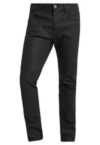 Svarta denimjeans med slim fit, med fem fickor, bältesöglor och knappstängning. Slät textur med subtila sömdetaljer.