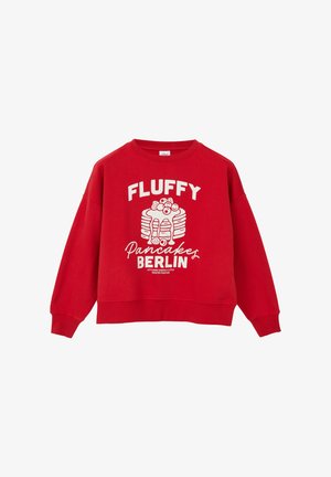 Czerwona bawełniana bluza z luźnym krojem, ściągaczami przy mankietach i u dołu. Zawiera biały napis oraz grafikę stosu naleśników z dodatkami.