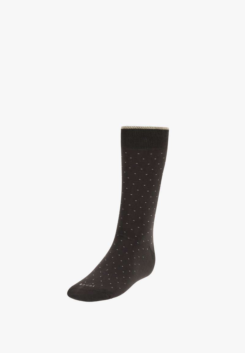 Calcetín negro hasta el tobillo con pequeños lunares blancos, puño acanalado, textura suave y puntera reforzada. Presenta un diseño sutil para mayor comodidad.