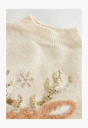 Pulover bej cu un decolteu ribbed, decorat cu coarne de ren din paiete aurii, un design cu fulgi de zăpadă și accente moi, pufoase.