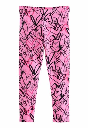 Leggings roses avec des motifs abstraits en forme de cœur noir et rouge, fabriqués en tissu flexible, dotés d'une taille élastique et d'un ajustement slim.