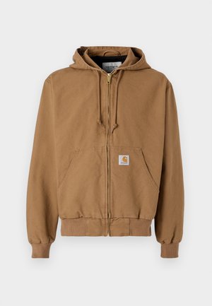 Bruine ritshoodie van katoen, voorzien van een voorzak, verstelbare koordjes en een vierkante logopatch op de linkerzak.