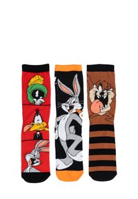 Tre paia di calzini per il tempo libero con colorati design di personaggi animati: rossi con Marvin il Marziano e Daffy Duck, grigi con Bugs Bunny, marroni a righe con Taz.