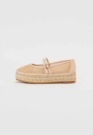 Espadrille à plateforme beige avec double bride autour de la cheville, semelle en jute tressé et dessus en tissu texturé, vue de profil.