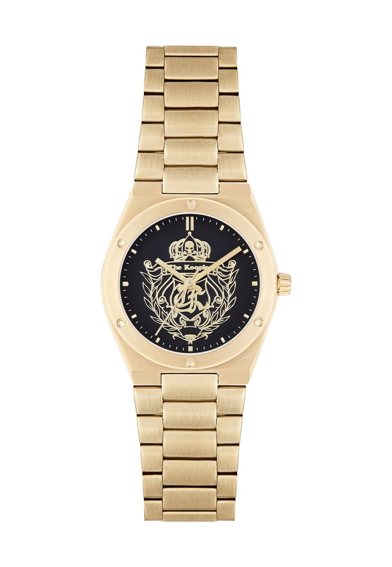 Goldene Metalluhr mit schwarzem Zifferblatt, das ein Kronen- und Totenkopfdesign zeigt, verziert mit einem Gliederarmband und goldenen Akzenten.