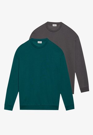 Two long-sleeve crewneck sweatshirts. One in teal and one in dark gray. Soft fabric, stretchable cuffs, and hem. Minimalist design.