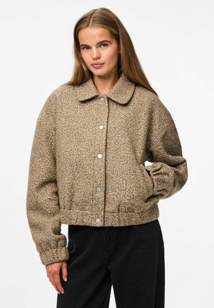 Brown textured jacket with a button-up front, collar, elastic cuffs, and a cropped fit. Made from a warm, fuzzy material.