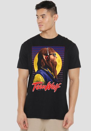 Black cotton t-shirt featuring a graphic design of a wolf-headed character with headphones, yellow and blue accents, and retro-style text.