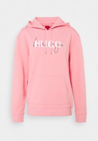 Felpa rosa con tasca frontale e cordini, con logo stilizzato "HUGO" bianco e nero sul petto.