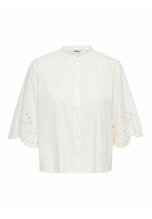 Weiße Bluse mit kurzen Puffärmeln, die gezackte, Lochstanz-Details und einen runden Kragen aufweist.