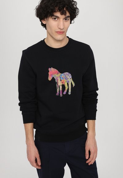 Black sweatshirt featuring a colorful horse graphic with abstract patterns. Ribbed cuffs and hem. Comfortable cotton blend.