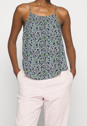 Haut sans manches à motif floral avec de fines bretelles, présentant un fond marine et des accents verts, roses et blancs. Tissu doux et léger.
