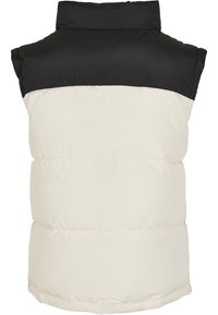 Weste aus Pufferstoff mit einem schwarzen oberen Abschnitt und einem cremefarbenen unteren Teil, mit hohem Kragen und gestepptem Design, ärmellos.