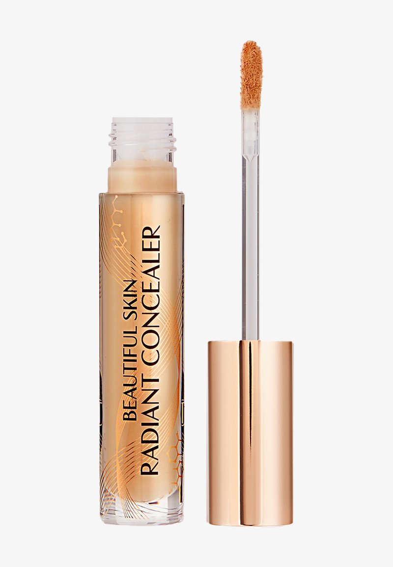 Concealer tube with gold cap and applicator wand, labeled "Beautiful Skin Radiant Concealer" in beige shade.