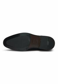 Black leather shoe sole with a smooth, polished finish. Features a tapered shape and textured grip at the heel. Brand logo embossed.