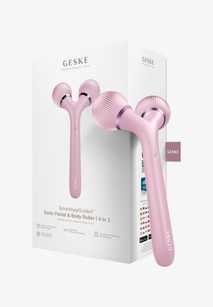 Roze dubbele bal gezichts- en lichaamsroller met geribbelde textuur, weergegeven naast witte verpakking met het label "GESKE" en productkenmerken.