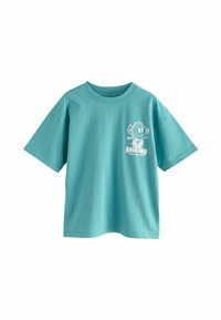 Camiseta de algodón turquesa con mangas cortas, que presenta un diseño gráfico impreso de una cara sonriente con auriculares en la parte frontal.