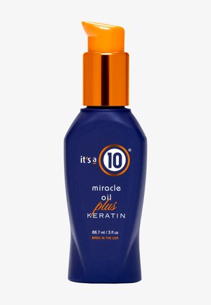 Bouteille bleue avec pompe orange portant l'étiquette "it's a 10 miracle oil plus keratin", 88,7 ml, fabriquée aux États-Unis.