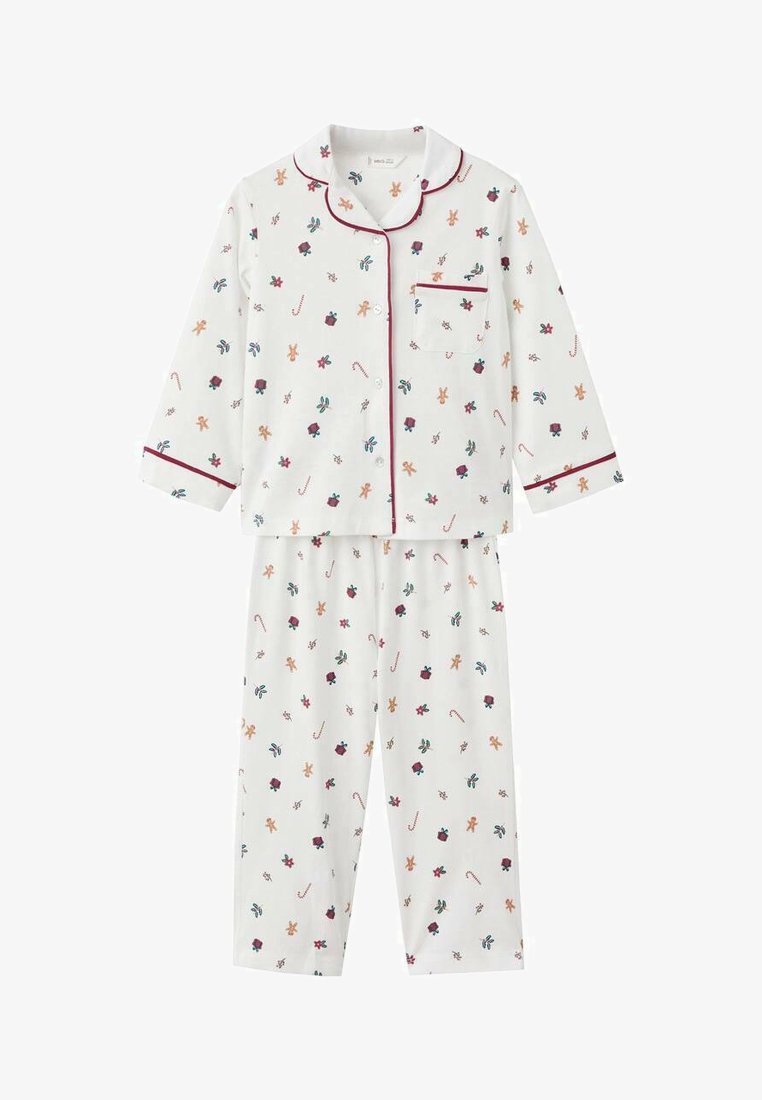 Bela pižama, ki vsebuje zgornji del s gumbi in hlače, okrašena s pisanim cvetličnim in medenjakovim vzorcem, obrobljena z malinasto rdečo obrobo.