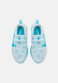 Light blue sneakers with a textured upper, white laces, and a blue Nike swoosh. Includes rear pull tab and cushioned sole.