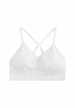 Valge bralette, millel on koondatud keskel, õhukesed reguleeritavad rihmad ja ribaline vöökoht all. Pehme kanga ja sile tekstuur.