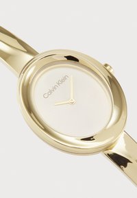 Calvin Klein TWISTED BEZEL - Orologio - gold-coloured